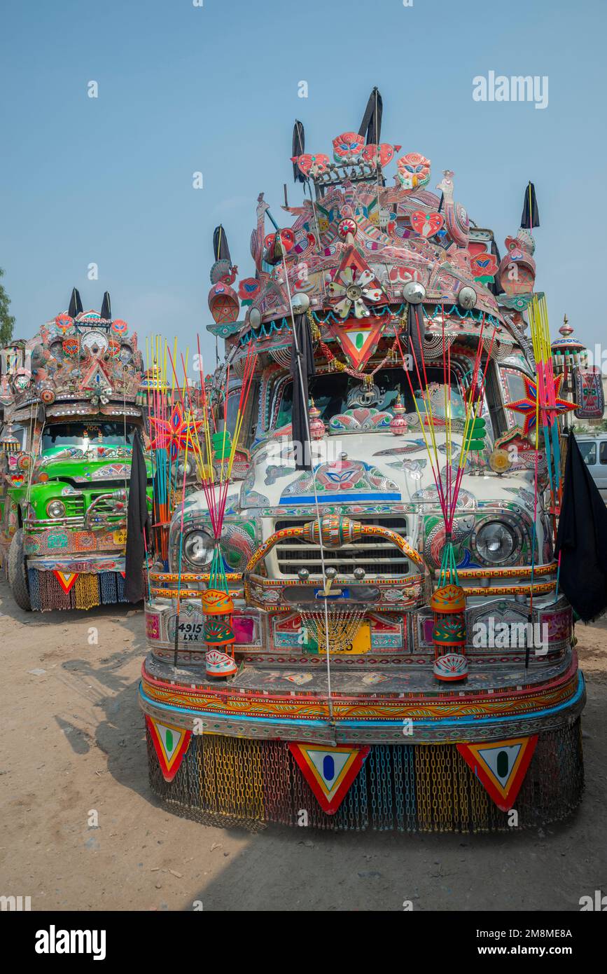 Colorfully painted buses at a bus station, Peshawar, Pakistan Stock Photo