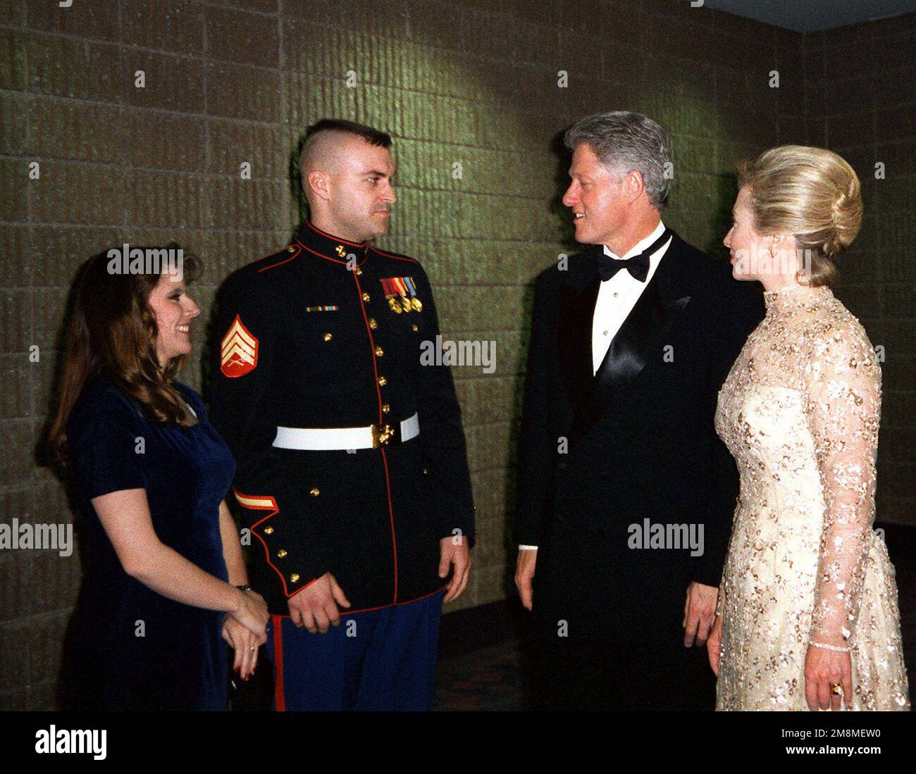 President William Jefferson Clinton and First Lady Hillary Rodham Clinton meet US Marine Corps Sergeant Heath Kuhlmann and his wife Monica at the Arkansas Ball. Kuhlmann stood in for the president during the January 12 dress rehearsal of the 1997 Presidential Inaugural Swearing-in Ceremony. Base: Washington State: District Of Columbia (DC) Country: United States Of America (USA) Stock Photo