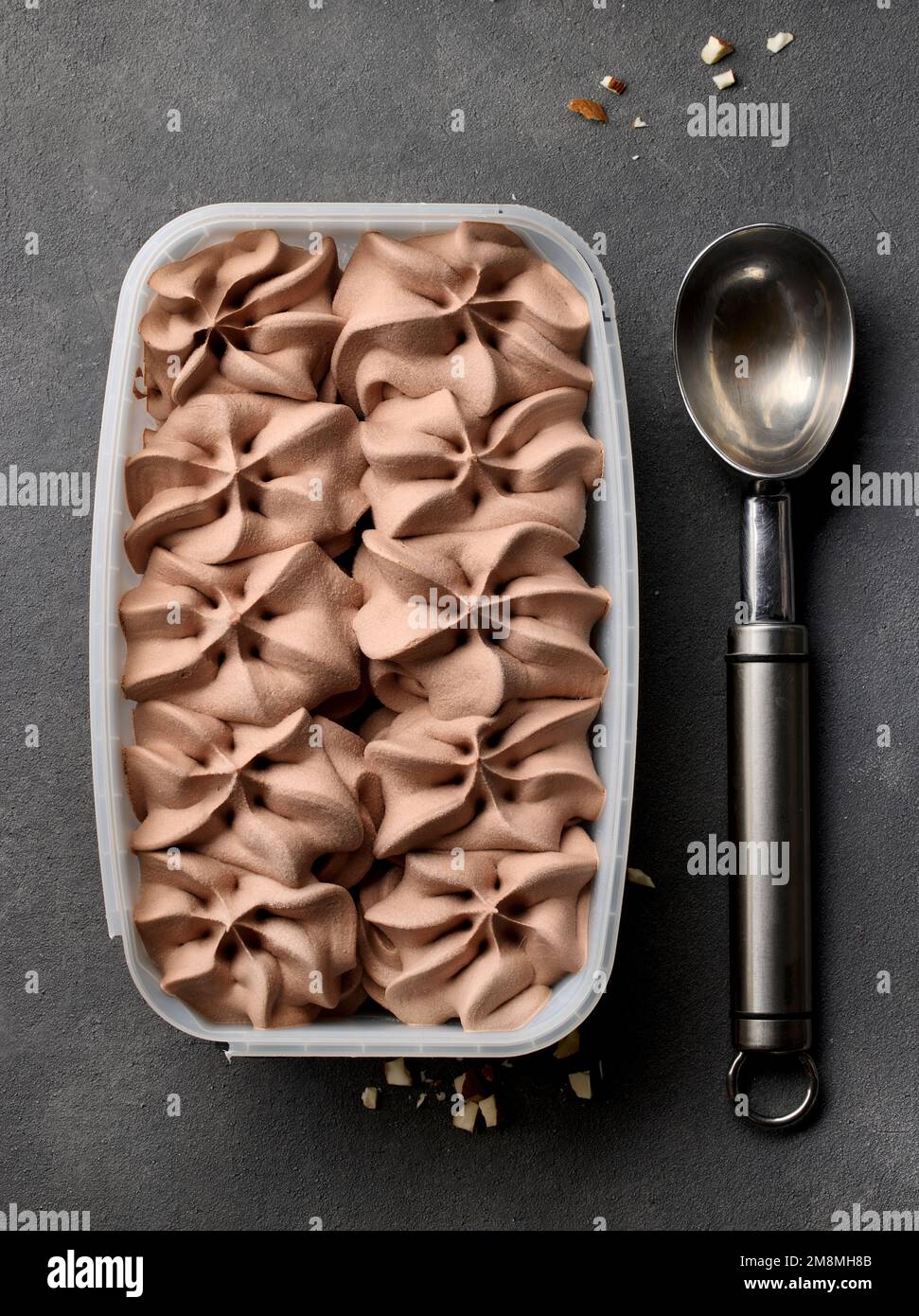 https://c8.alamy.com/comp/2M8MH8B/open-chocolate-ice-cream-package-on-grey-table-top-view-2M8MH8B.jpg