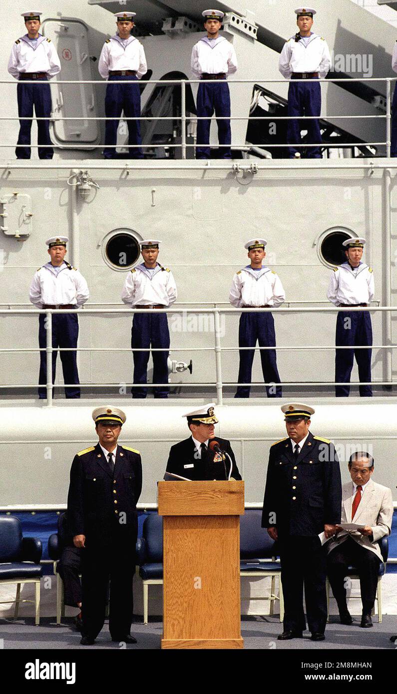 US Navy Admiral Brent M. Bennitt (center), Commander Naval Air Force Pacific, speaks during welcoming ceremonies for the People's Republic of China. Admiral Bennitt is accompanied by Chinas Admiral He (left) and Admiral Wang (right). This marks the first time Chinese warships have crossed the Pacific and visited the Continental United States. The Luhu Class Destroyer HARIBING (DDG 112), Luda II Class Destroyer, ZHUHAI (DDG 166), and a supply ship, the Fusu Class, NANYUN (AOR/AK 953) (Only one of the Chinese destroyers is shown in this image), stopped at Naval Station, North Island, San Diego, Stock Photo