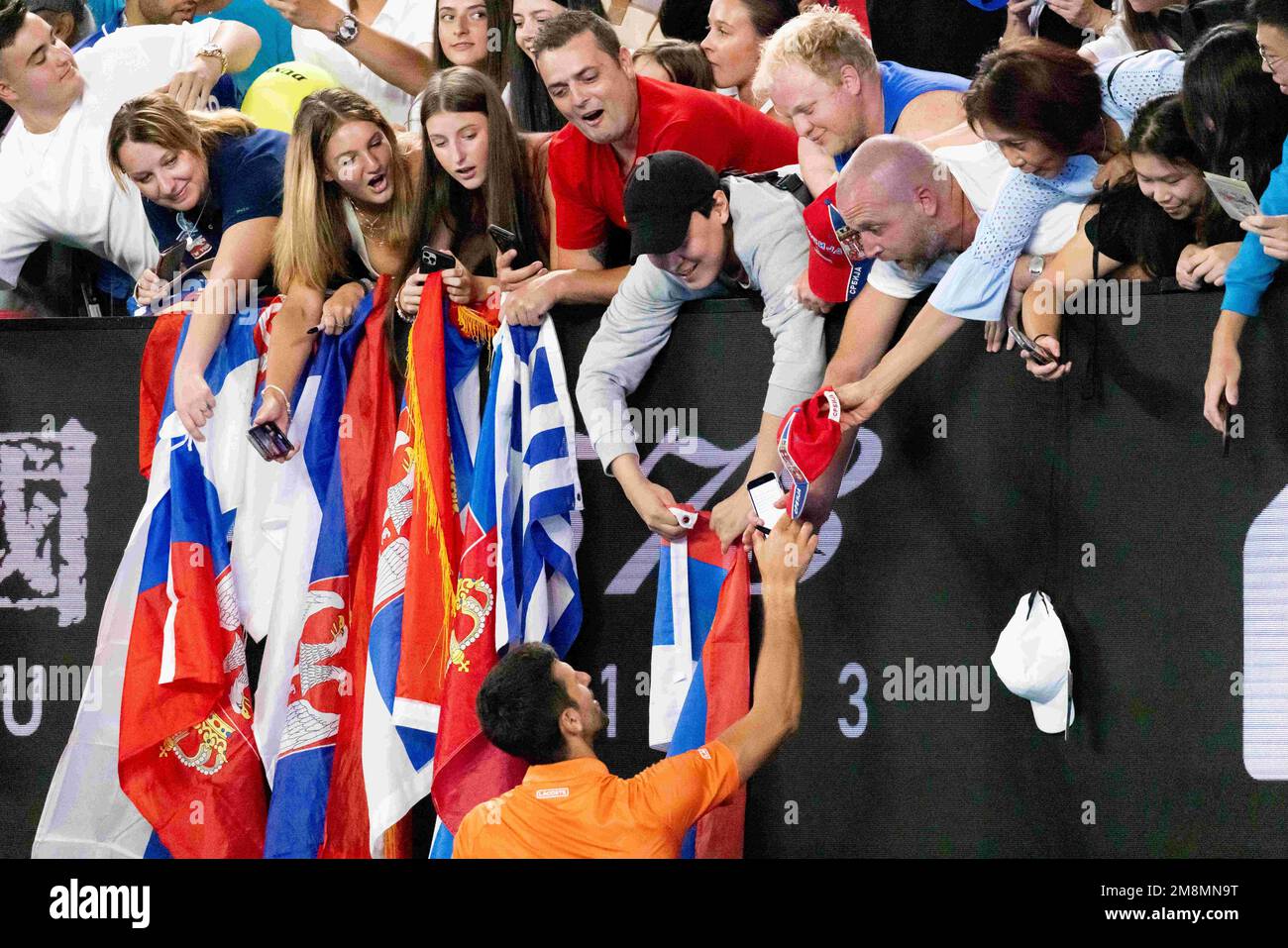 Melbourne, Victoria, Australia. 13th Jan, 2023. MELBOURNE, AUSTRALIA - JANUARY 13: Novak Djokovic of Serbia signs autographs after playing Nick Kyrgios of Australia in a showdown charity match ahead of the 2023 Melbourne, Victoria, Australia. 13th Jan, 2023. MELBOURNE, AUSTRALIA - JANUARY 13: Novak Djokovic of Serbia signs autographs after playing Nick Kyrgios of Australia in a showdown charity match ahead of the 2023