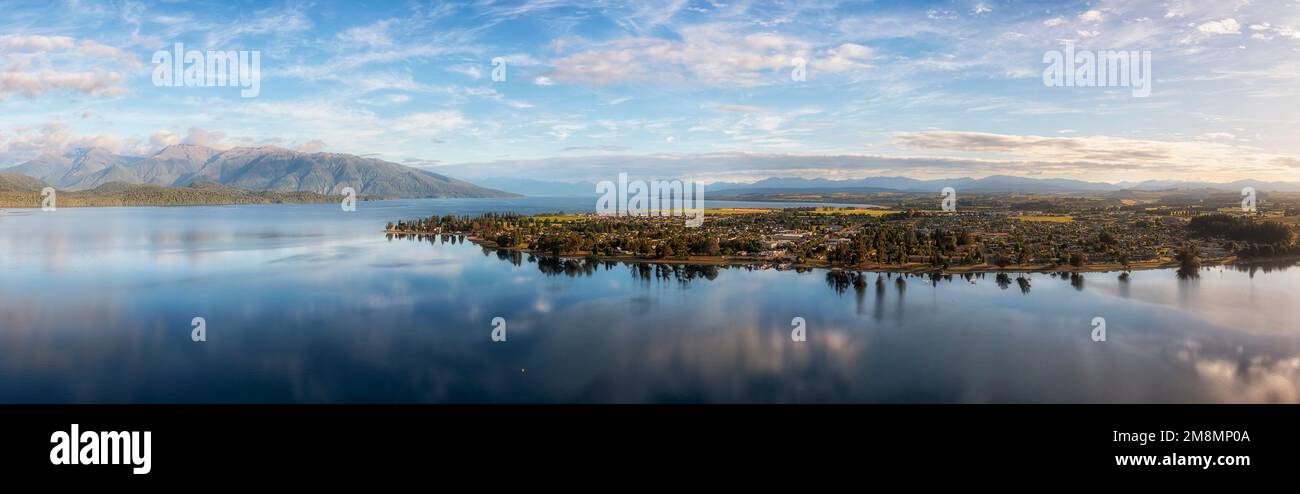 Scenic aerial panorama of Te Anau lake and Te Anau town in New Zealand - a gateway to Milford Sound fiordlands. Stock Photo