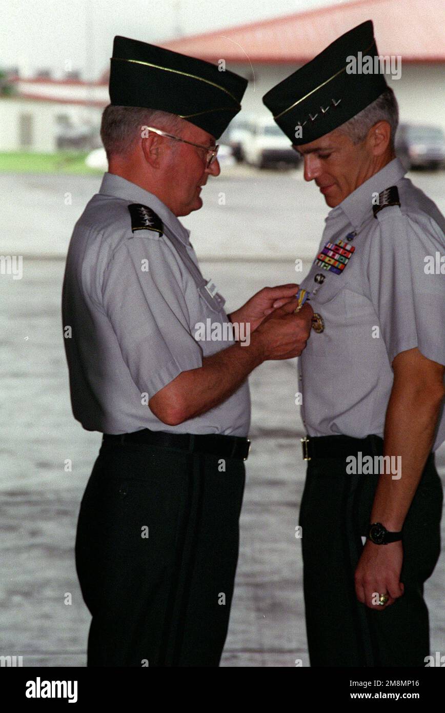 General John M. Shalikashvili (left), pins medal onto General Wesley K. Clark during the US Southern Command (USSOUTHCOM) Change of Command Ceremony. Base: Howard Air Force Base Country: Panama (PAN) Stock Photo