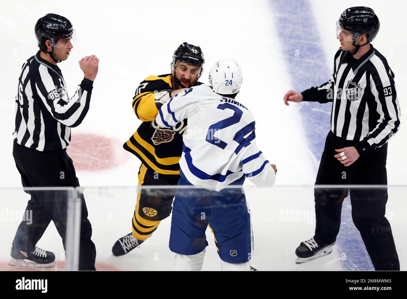 Toronto Maple Leafs' Wayne Simmonds (24) and Boston Bruins' Nick Foligno  (17) fight during the first period of an NHL hockey game Saturday, Jan. 14  2023, in Boston. (AP Photo/Michael Dwyer Stock Photo - Alamy
