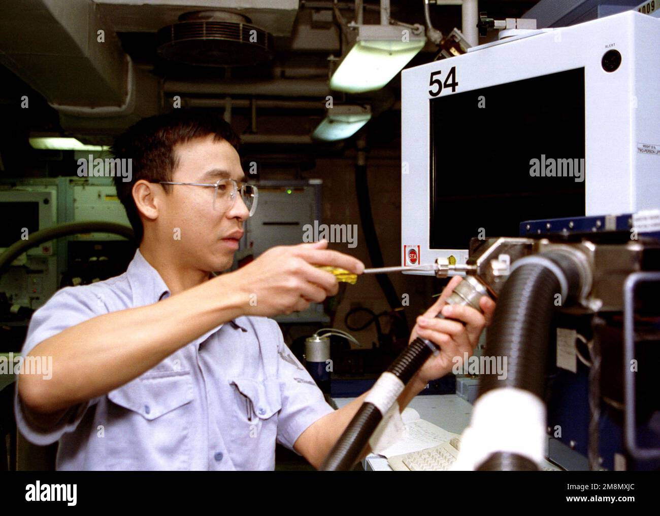 Aviation Electronics Technician 3rd Class Long Tran trouble shoots a ...