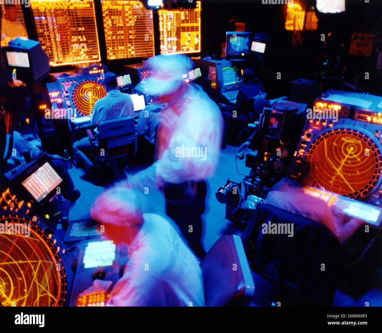 Military Photographer of the Year Winner 1998 Title: Controlling the skies Category: Pictorial Place: Second Place PictorialAir traffic controllers working in the CATCC (Carrier Air Traffic Control Center) assist in guiding aircraft on and off the flightdeck of the USS Enterprise (CVN 65). Country: Unknown Stock Photo