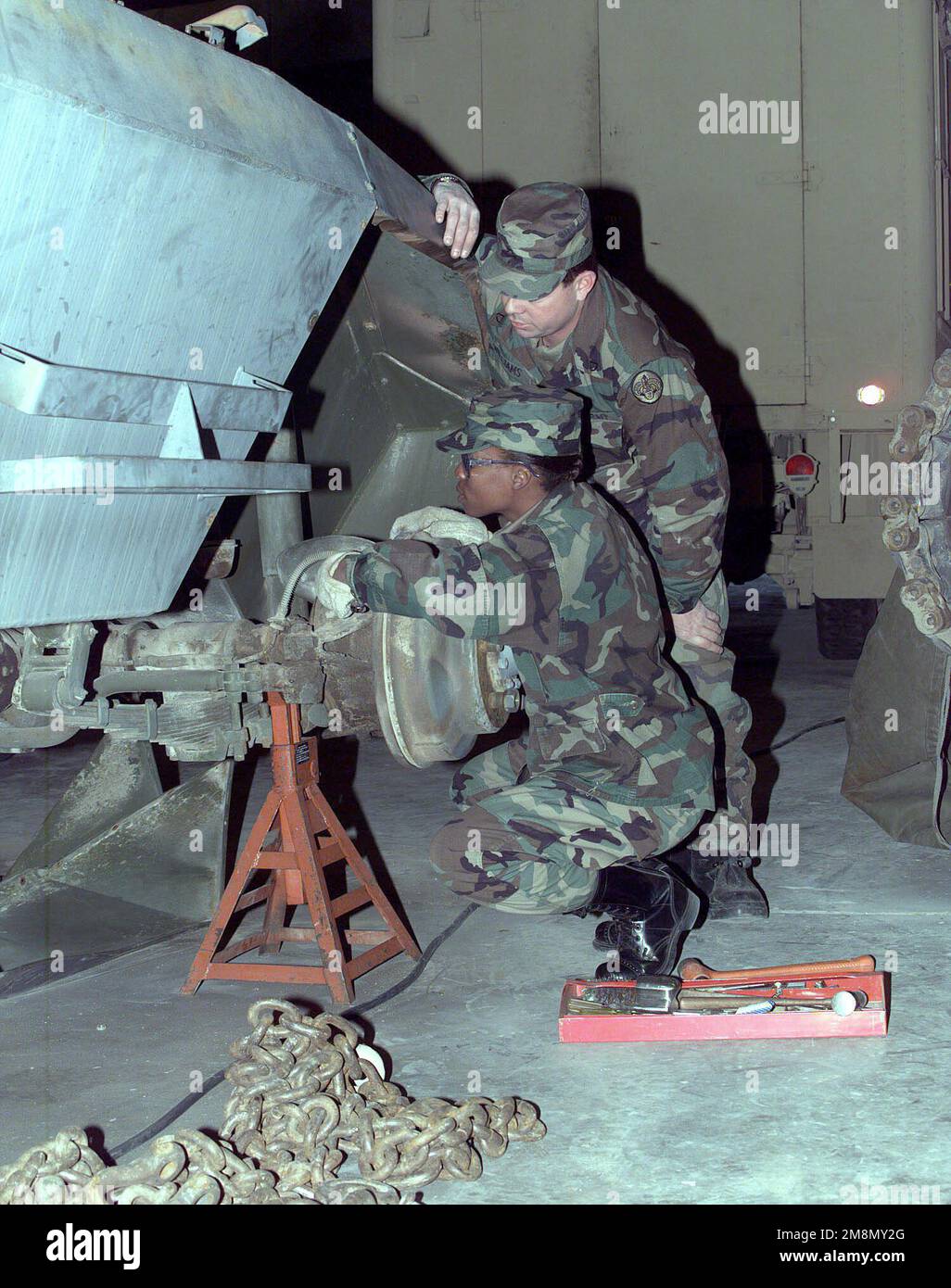 PFC Brian Williams, welder and Private Jacqueline Baker, body restoration both from the 43rd Engineers, attached to the 3rd Armored Cavalry Regiment (ACR), are working to restore a WWII M-20 armored car which will go on display at the 3rd Cavalry Museum. Base: Fort Carson State: Colorado (CO) Country: United States Of America (USA) Stock Photo
