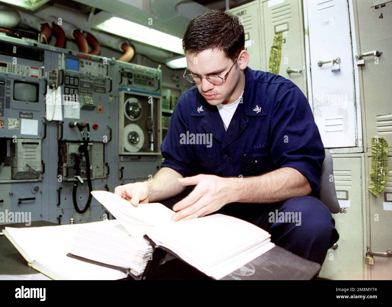US Navy Aviation Electronics Technician 3rd Class Jose Miller examines
