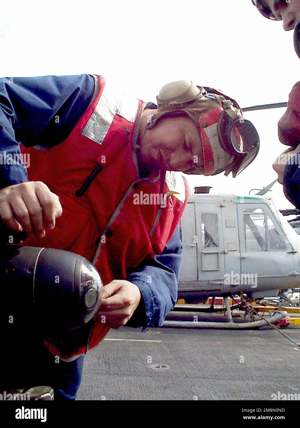 US Marine Corps GUNNERY Sergeant (GYSGT) Thomas M. Martinez cleans the