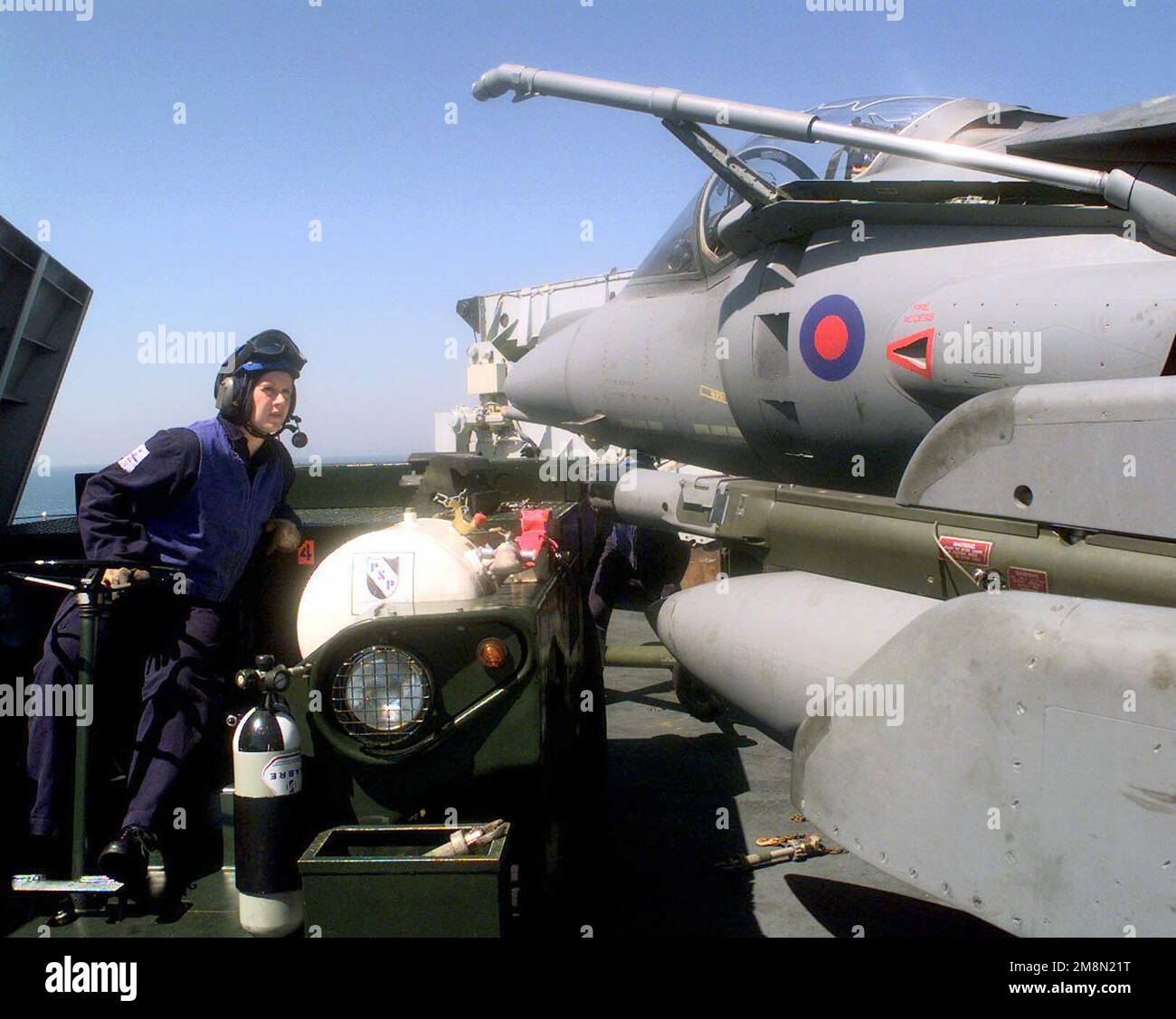 British Naval AIRMAN Jennifer Ennis prepares to position a Royal Air