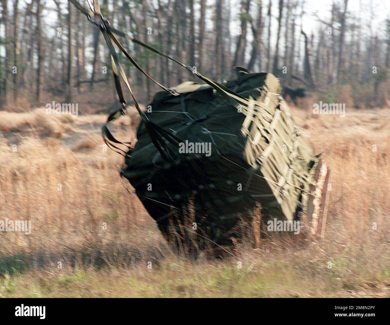 The package that dropped from a CH-53E Sea Stallion helicopter hits the ...