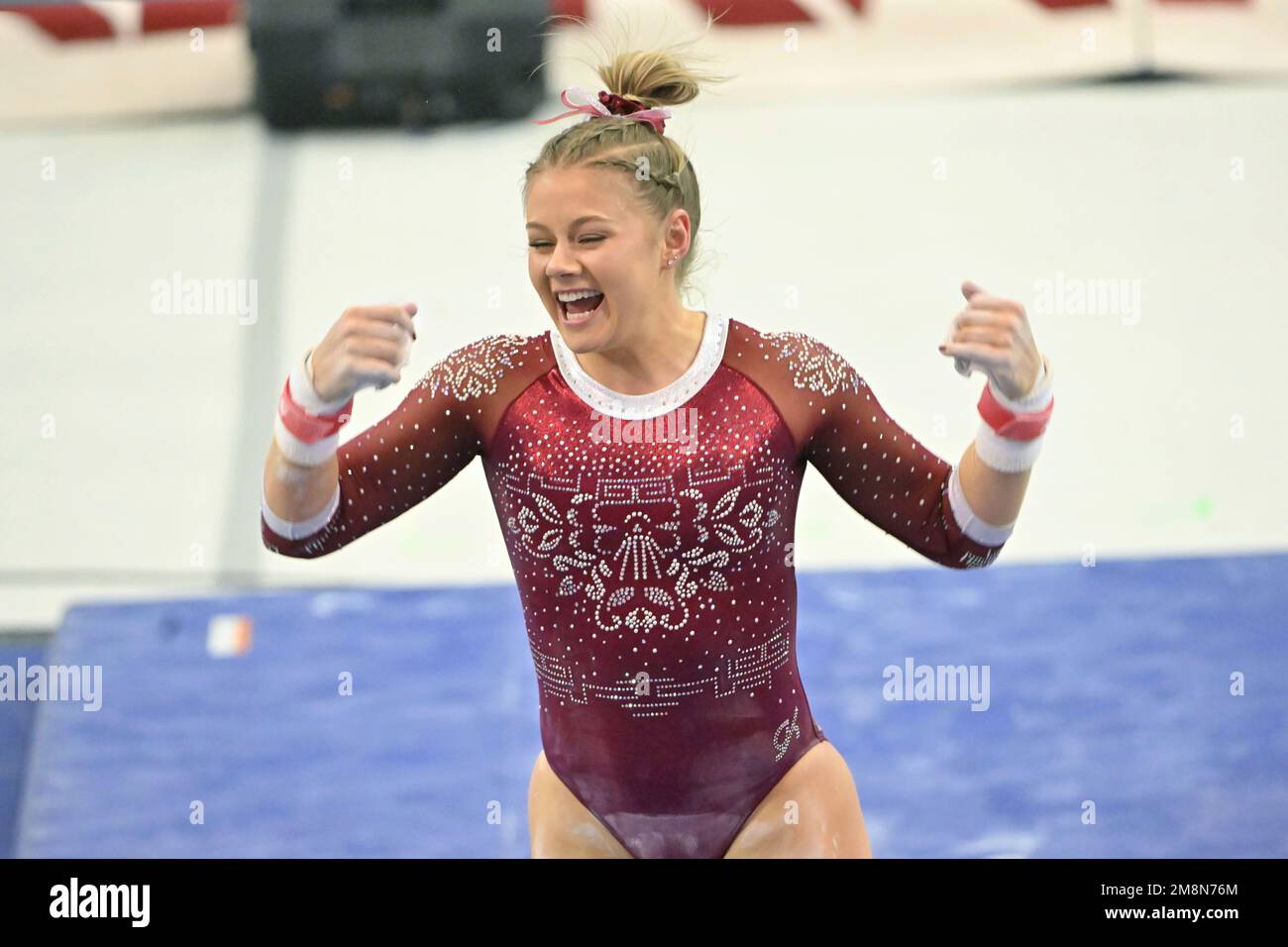 Alabama gymnast Mati Waligora competes on the bars against Arkansas