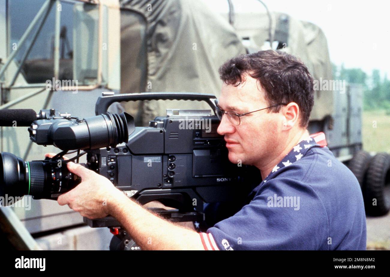 Sergeant Gary Chancey, Visual Information Support Center, Rapid Response  Team operates a Sony videotape recorder at the Logistical Operations  Support Area, located at the Kinston Airport, following Hurricane Bonnie.  Base: Kinston State: