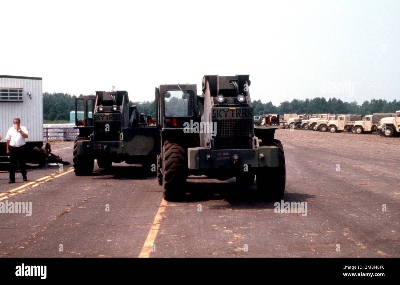 A rear view of two TRAK AllTerrain Lifter Army System (ATLAS) parked