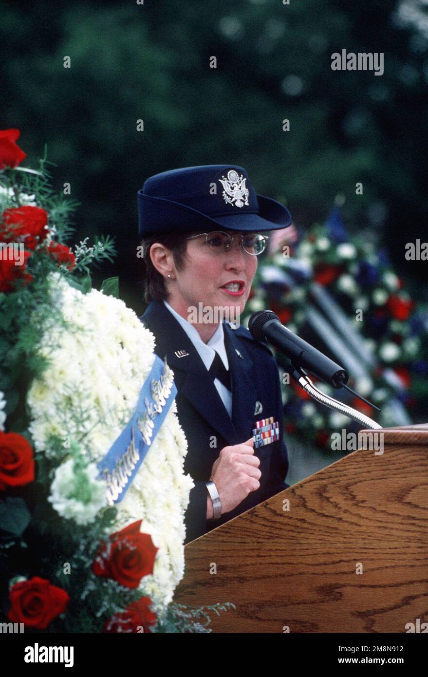 Right side front medium shot from the chest up of USAF Captain Pat Blassie as she speaks a few words about her brother, USAF First Lieutenant Michael Blassie. CAPT Blassie serves in the Air Force Reserves in the Pentagon. 1LT Blassie was shot down and killed in South Vietnam on May 11th, 1972. A mix up with dog tags and body identification led the remains listed as Unknown and buried in the tomb of the Unknown Soldier at Arlington National Cemetery (Not shown). Using DNA testing on May 14th, 1998, the remains were indentified as those of 1LT Blassie and services were held in his honor. This im Stock Photo