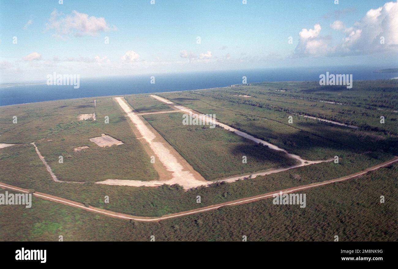 Aerial view showing the North Field runways used for airdrops and evacuation of personnel, on the Island of Tinian, during Exercise TANDEM TRHUST 99. Subject Operation/Series: TANDEM THRUST 99 Base: North Field, Tinian Island Country: Northern Mariana Islands (MNP) Stock Photo