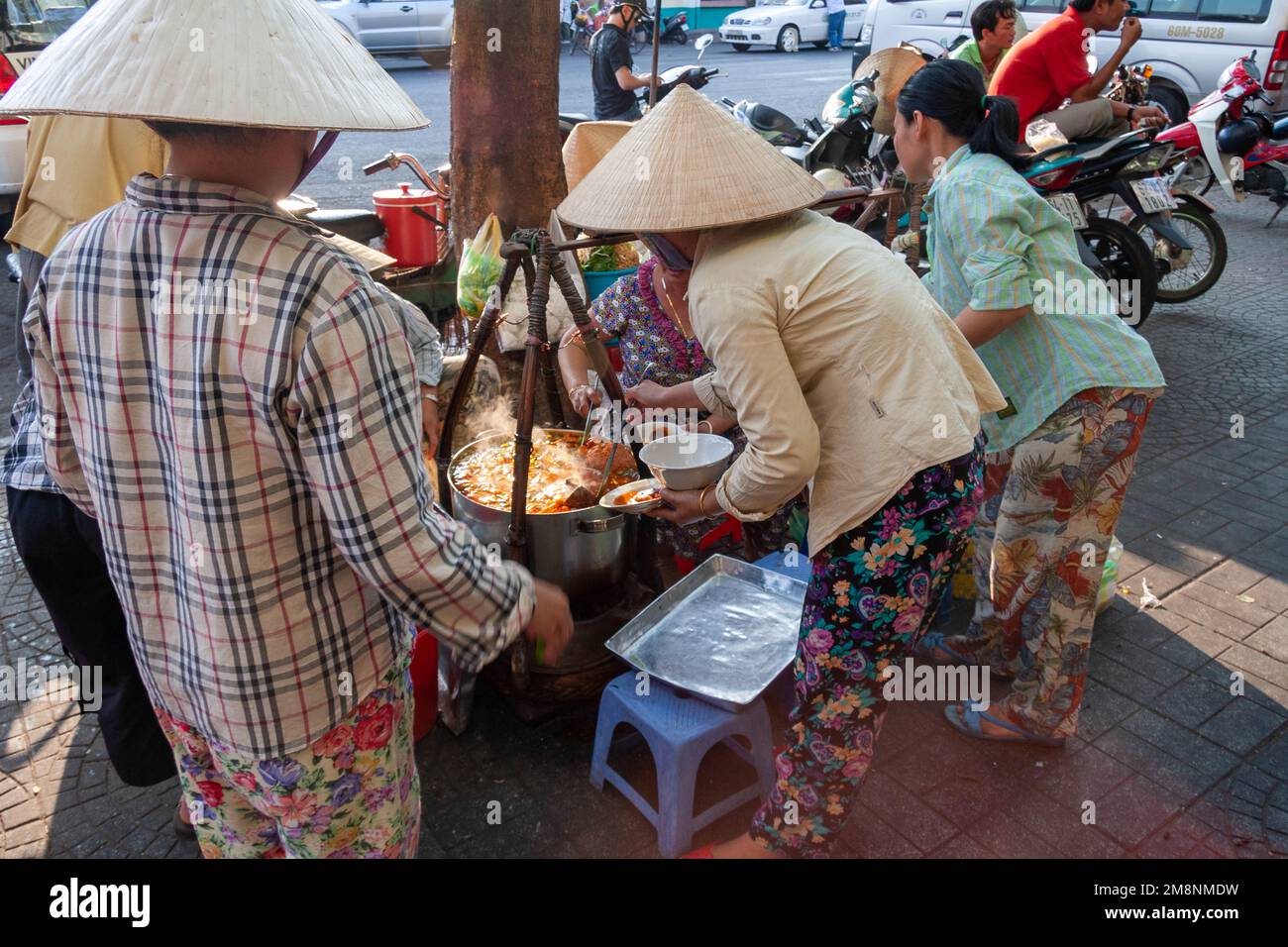 Busy street food restaurant in Saigon Ho Chi Minh City, Vietnam Stock Photo