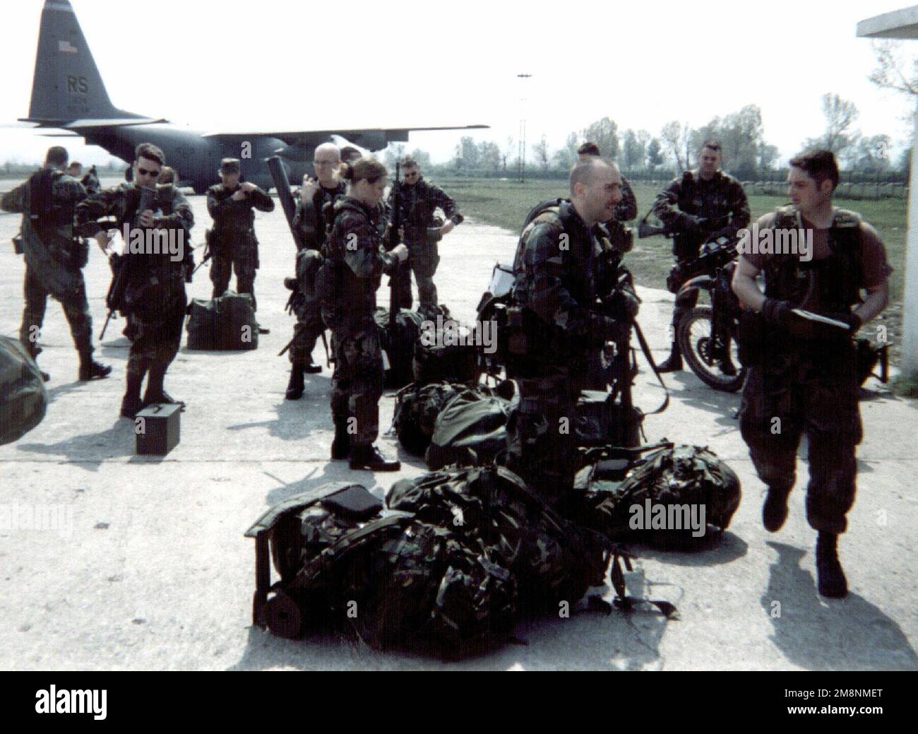 Security forces from the 86th Contingency Response Group at Ramstein Air Base, Germany, arrive in Tirana, Albania, on April 10, 1999, in support of Operation Sustain Hope the U.S. effort to bring in food, water, medicine, relief supplies, and to establish camps for the refugees (all not shown) fleeing from the Former Republic of Yugoslavia into Albania and Macedonia. Subject Operation/Series: SUSTAIN HOPE Base: Tirana Country: Albania (ALB) Stock Photo