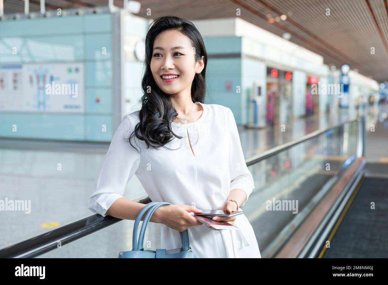 The young woman at the airport Stock Photo - Alamy