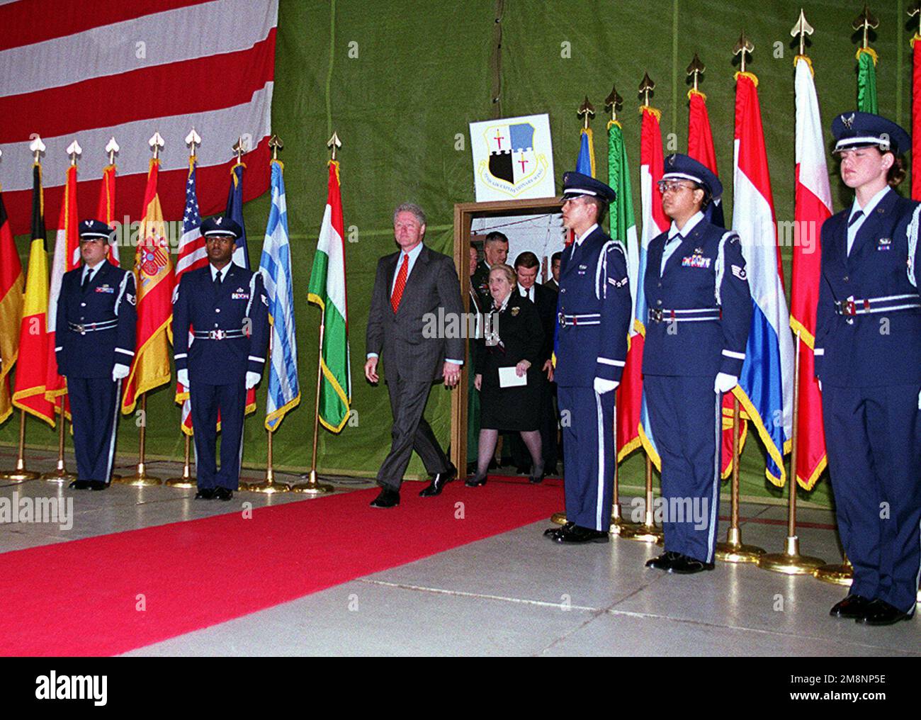 Spangdahlem rolls out the 'red carpet' for President William Jefferson Clinton May 5. The president visited the U.S. air base in Germany to thank the troops (not shown) for their support of Operations Allied Force and Shining Hope. Also seen entering the room, in the background, is Secretary of State Madeline Albright, Secretary of Defense William Cohn and Chairman of the Joint Chiefs of STAFF, US Army GEN Henry Shelton. Subject Operation/Series: ALLIED FORCESHINING HOPE Base: Spangdahlem Air Base State: Rheinland-Pfalz Country: Deutschland / Germany (DEU) Stock Photo