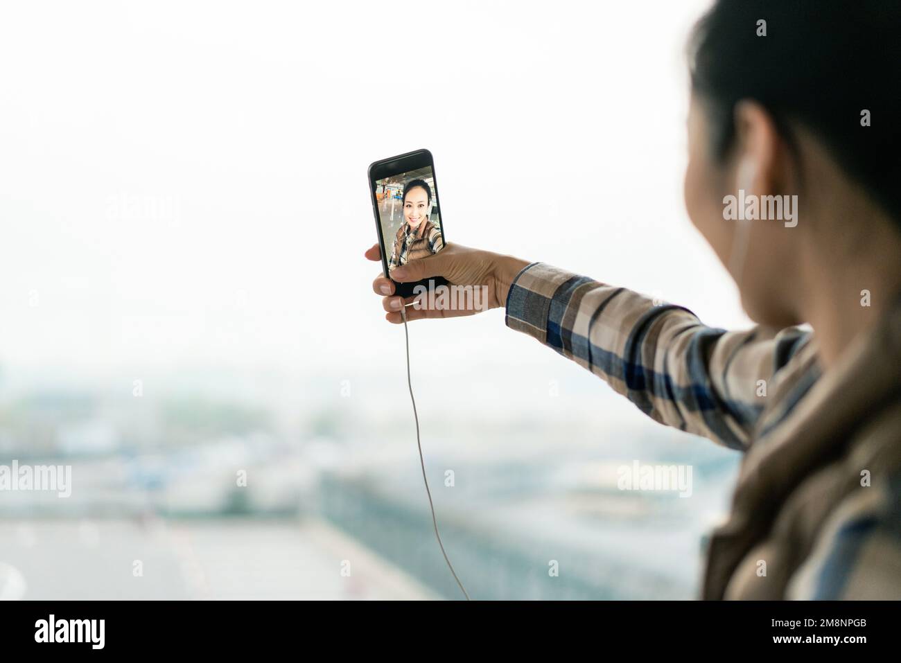 The young woman at the airport Stock Photo - Alamy