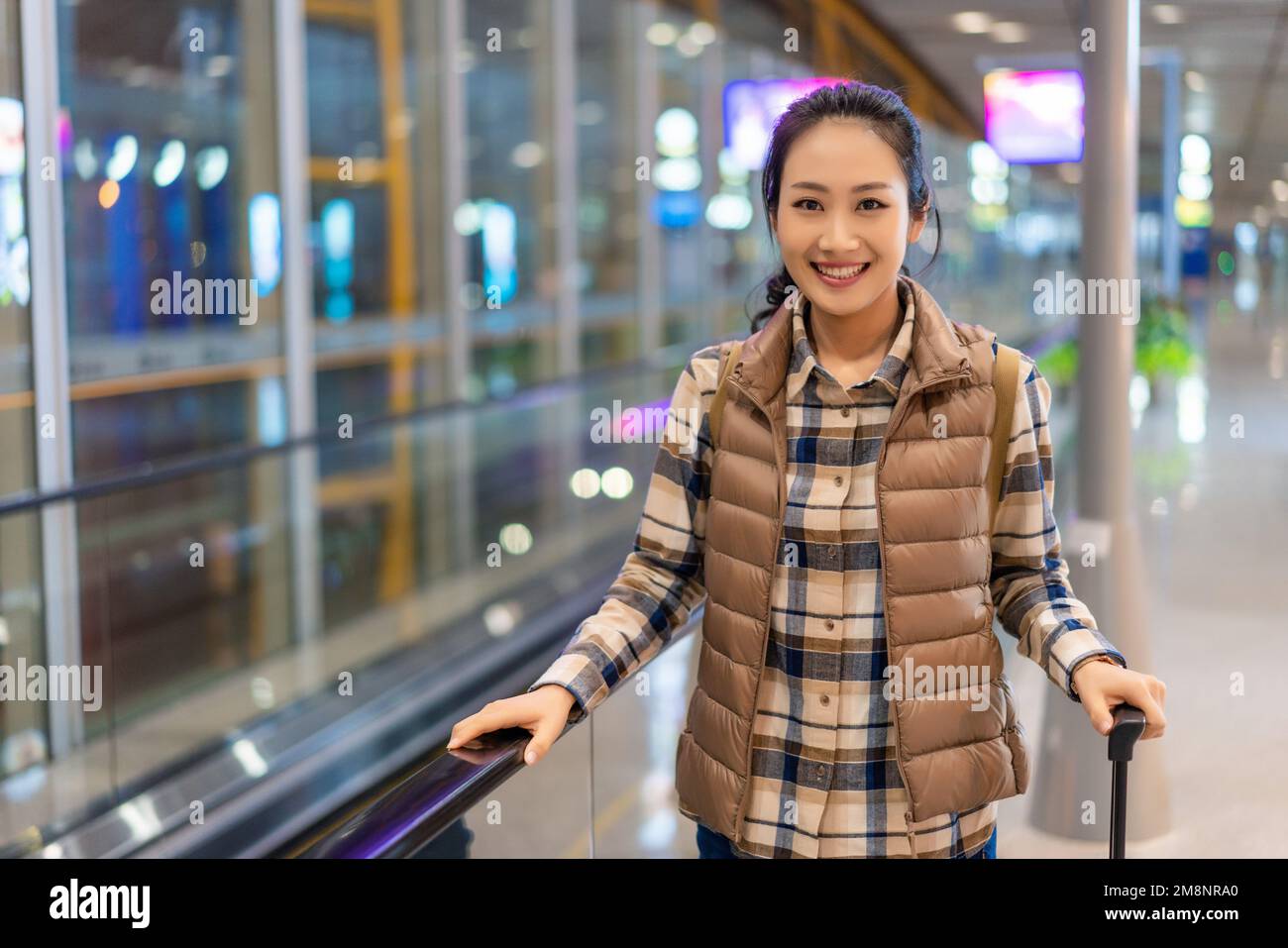 The young woman at the airport Stock Photo - Alamy