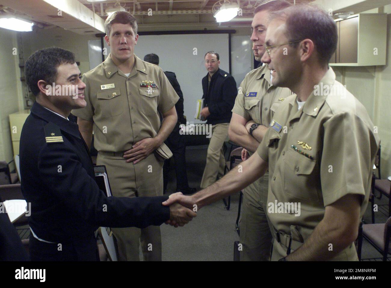 US Navy Lieutenant Commander Steve Brown, Operations Officer from USS TUCSON (SSN 770) meets with Chilean submarine officers aboard the Chilean vessel BLANCO ENCALADA (DLH 15) as Exercise TEAMWORK SOUTH '99 kicks off in Valparaiso, Chile. Subject Operation/Series: TEAMWORK SOUTH '99 Base: Blanco Encalada (DLH 15) Stock Photo