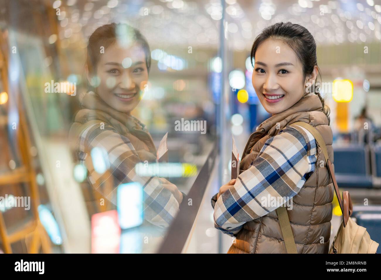 A young woman in the airport lounge Stock Photo - Alamy
