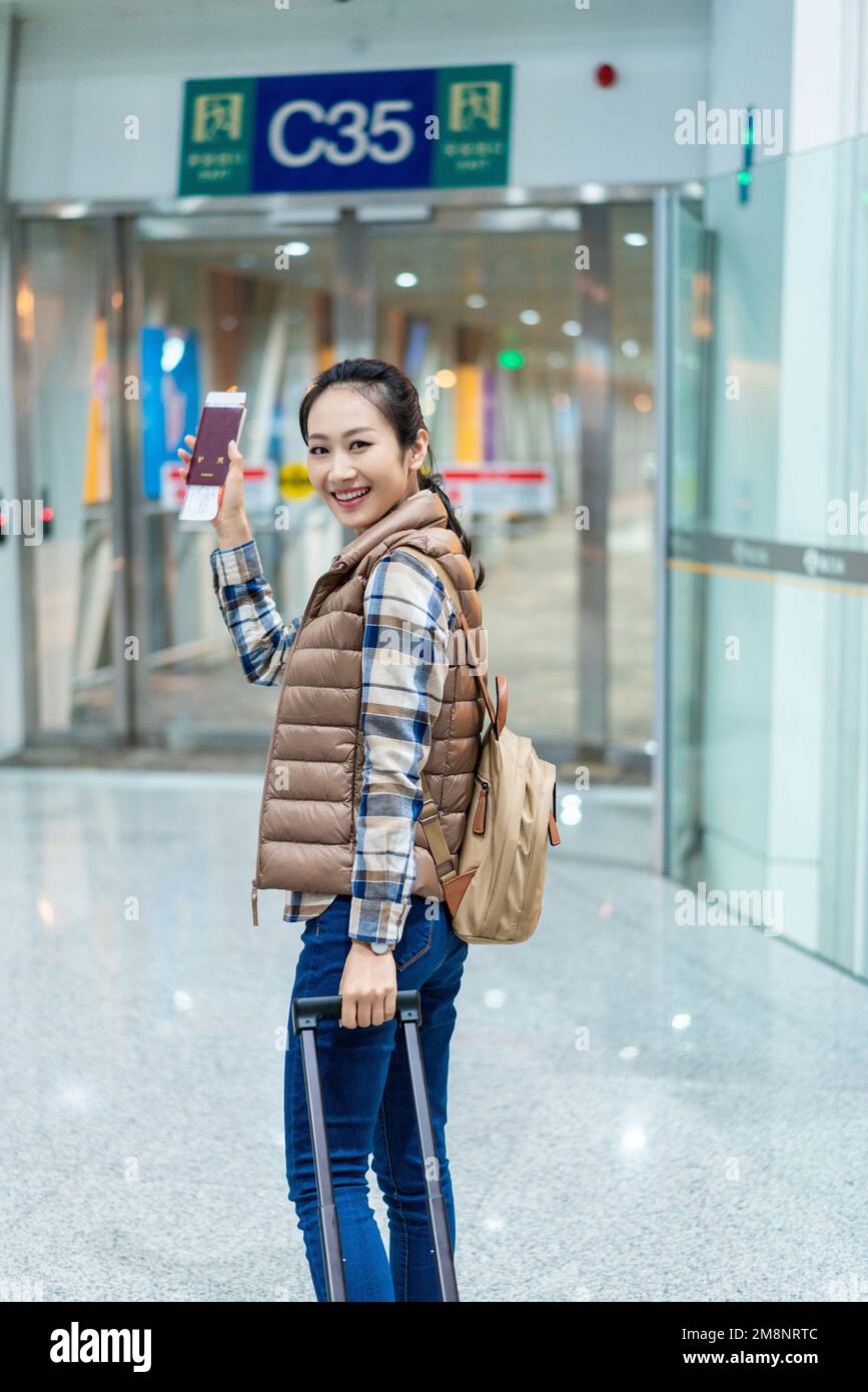 The young woman at the airport Stock Photo - Alamy