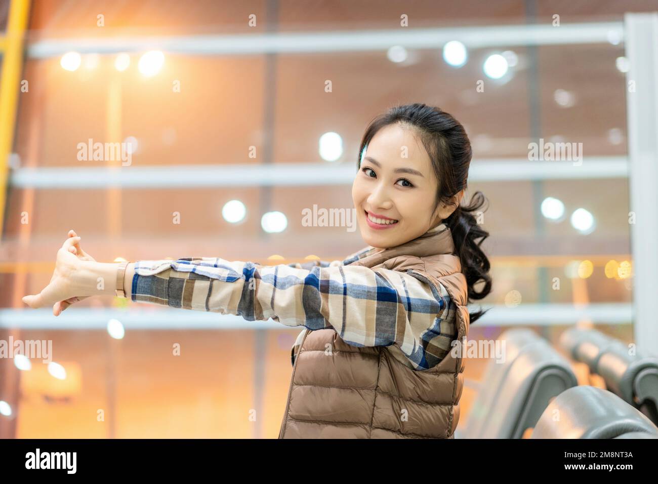 The young woman at the airport Stock Photo - Alamy