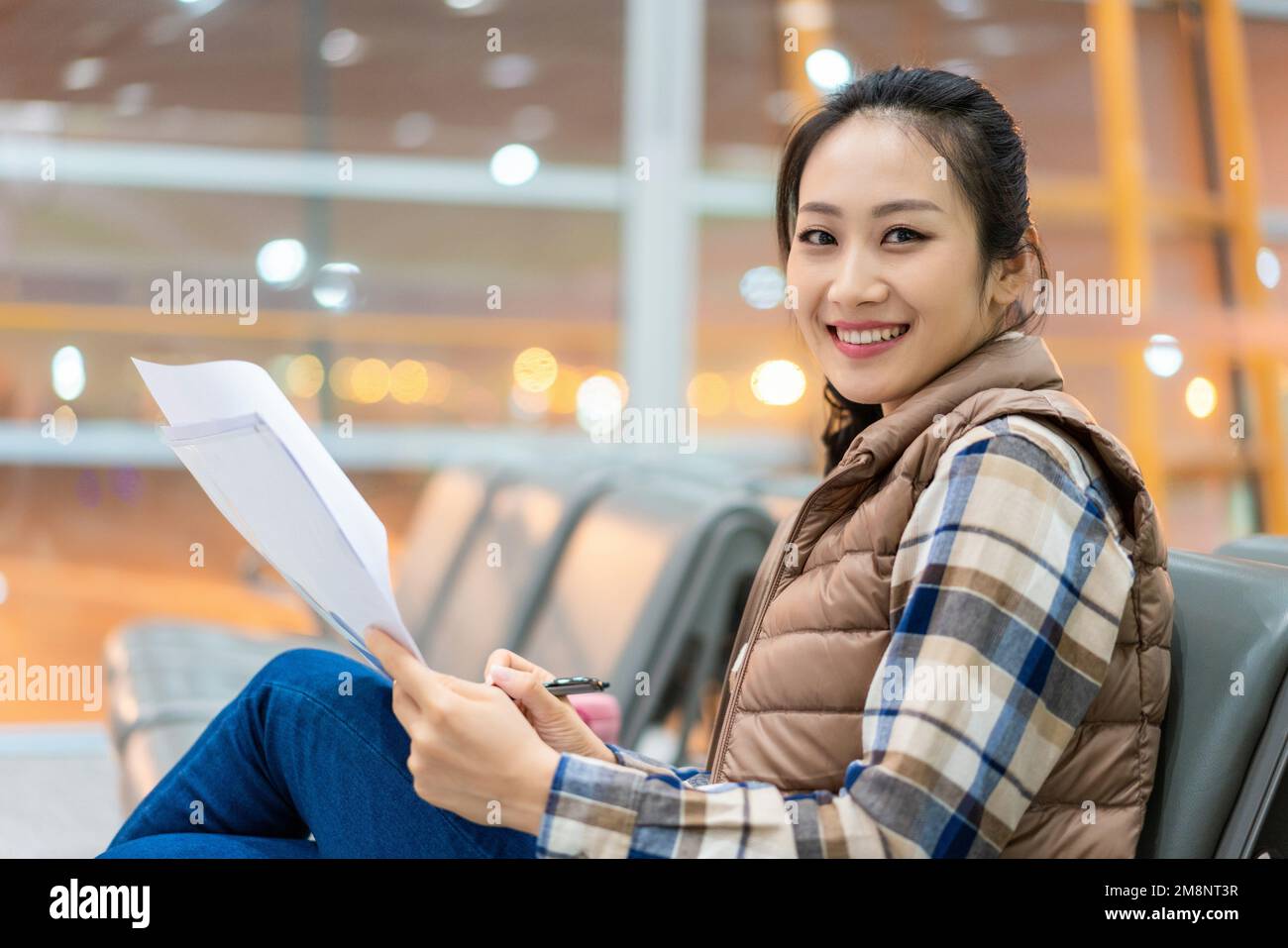 The young woman at the airport Stock Photo - Alamy