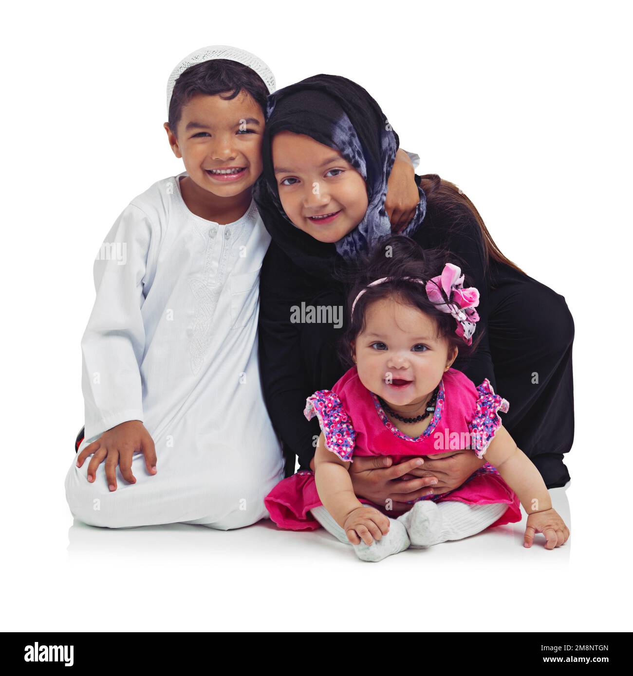 Portrait, children and muslim with a girl, boy and sister in studio isolated on a white background for religion or belief. Family, kids or islam with Stock Photo