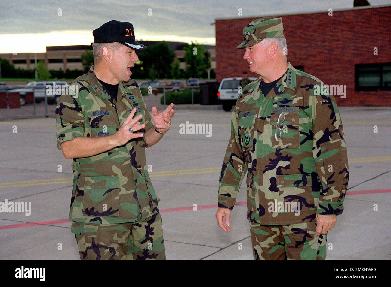 US Air Force Brigadier General Jerry M. Drennan (Left), Commander, 21st Space Wing, Peterson Air Force Base, Colorado, speaks with USAF CHIEF of STAFF, General Michael Ryan before his departure from Peterson AFB, CO, on September 2nd, 1999. Base: Peterson Air Force Base State: Colorado (CO) Country: United States Of America (USA) Stock Photo