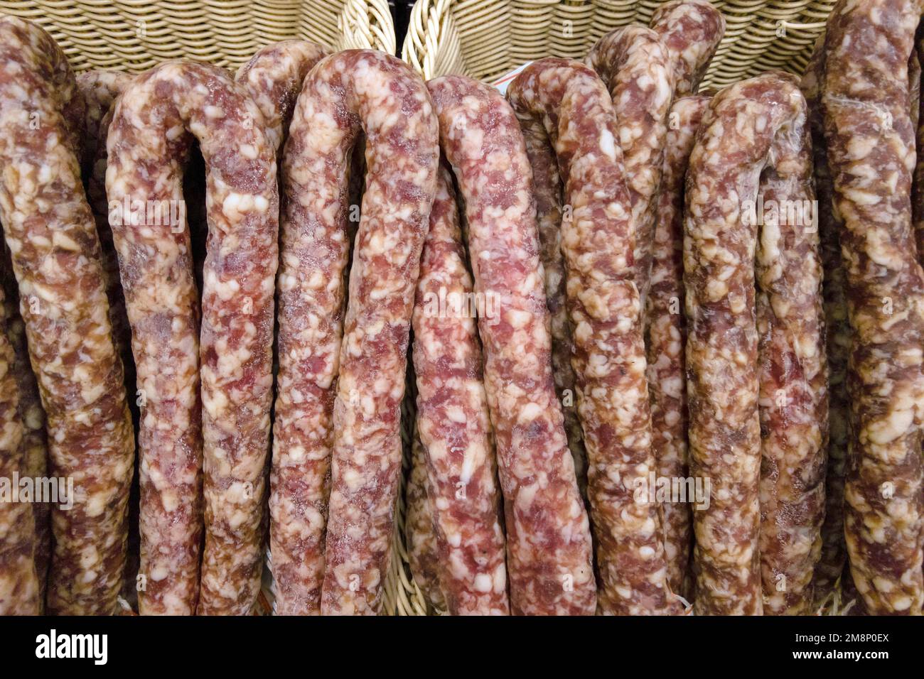 background from sausage. dry homemade sausage on the supermarket shelf