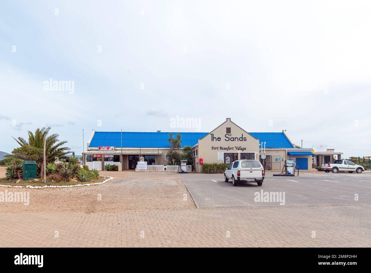 Witsand, South Africa - Sep 24, 2022: The Sands shopping centre at the entrance of Witsand and Port Beaufort. Vehicles are visble Stock Photo