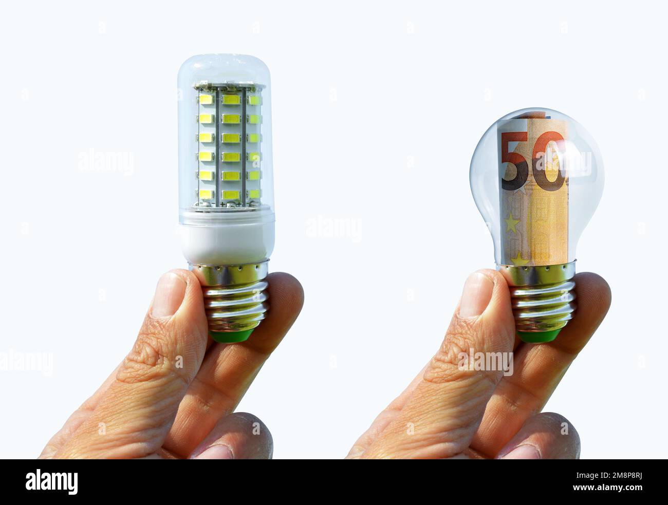 Hands holding light bulb isolated on white background. Concept of saving money for energy. Stock Photo