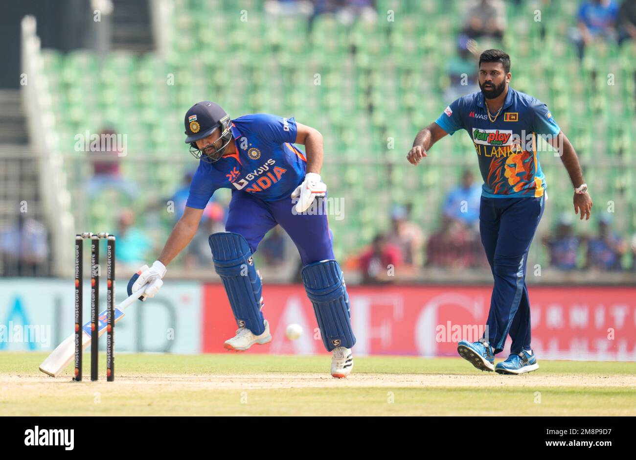 Sri Lanka's Lahiru Kumara, right, watches as India's captain Rohit ...