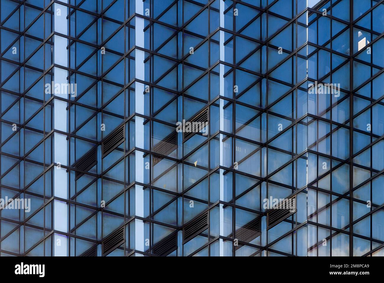 An abstract image of a modern office building with criss-cross patterns in Tokyo, Japan. Stock Photo