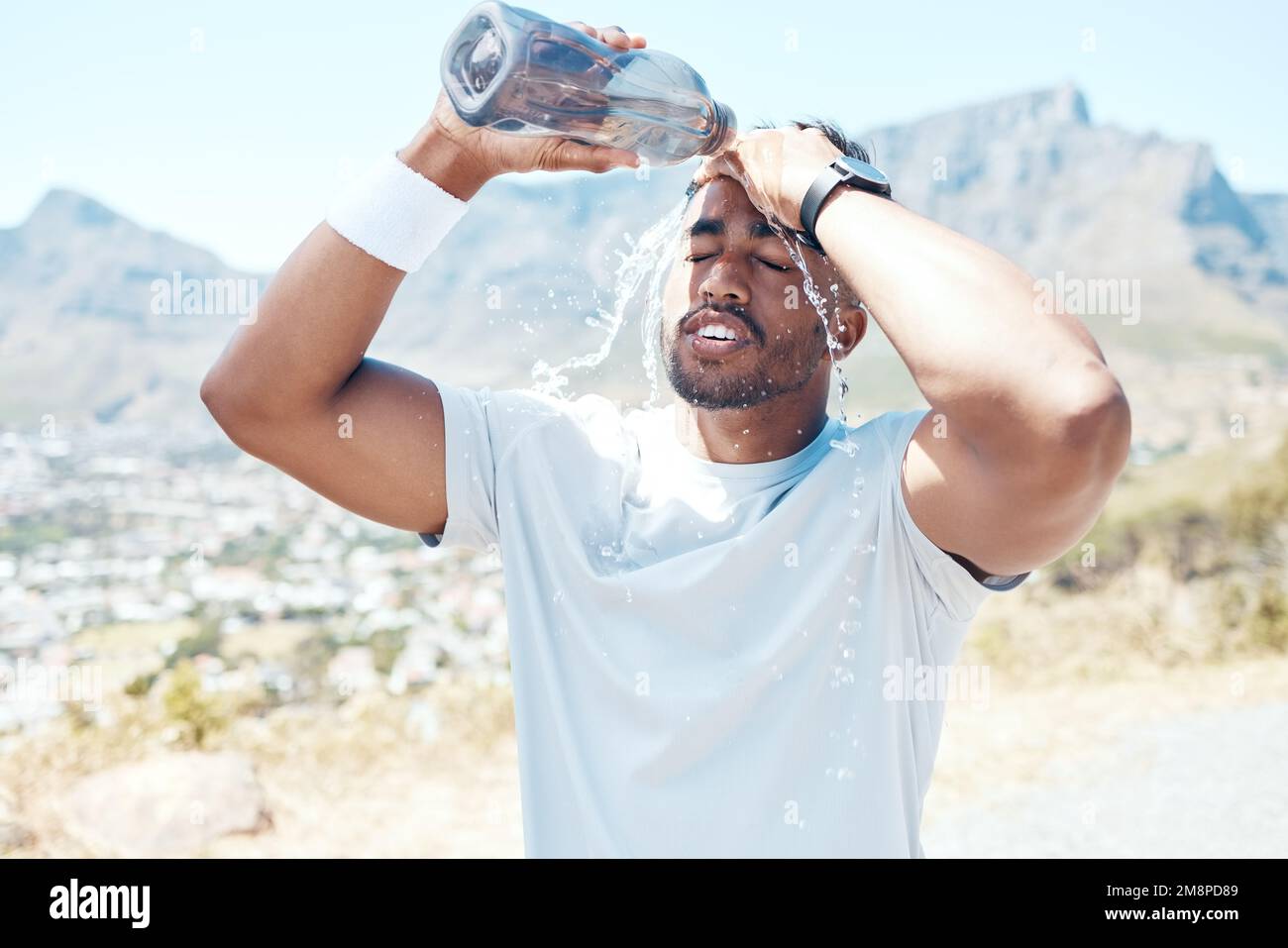 https://c8.alamy.com/comp/2M8PD89/closeup-of-a-handsome-young-man-standing-alone-and-pouring-water-on-his-face-after-a-run-outdoors-fit-indian-male-getting-hot-and-cooling-down-with-2M8PD89.jpg