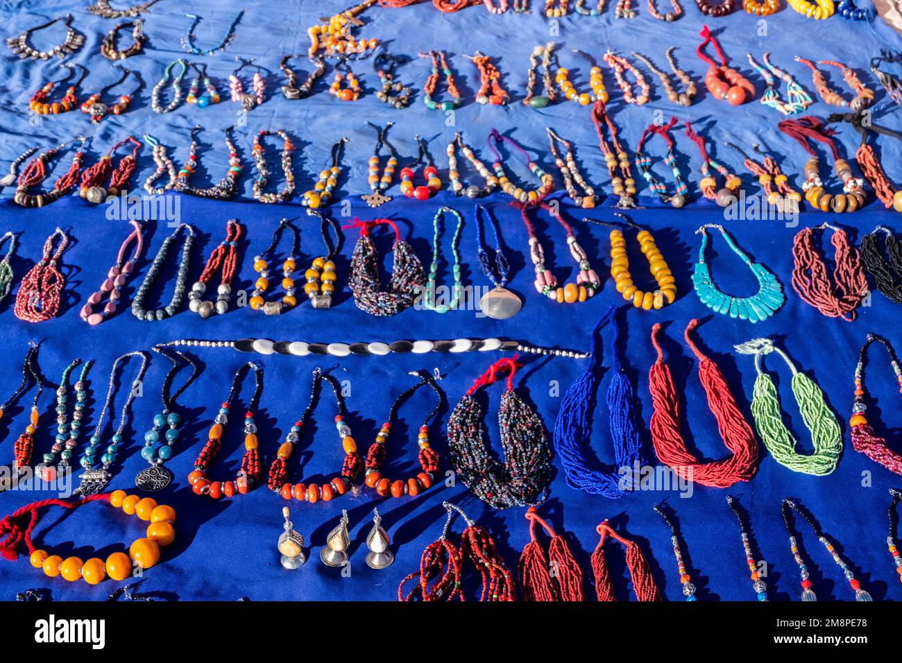 A colorful Moroccan market scene along a bustling street selling handcrafted goods Stock Photo