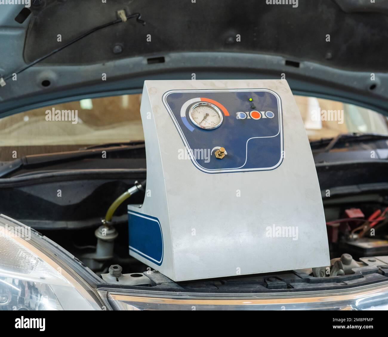 Automated change of brake fluid in a car service. Car Stock
