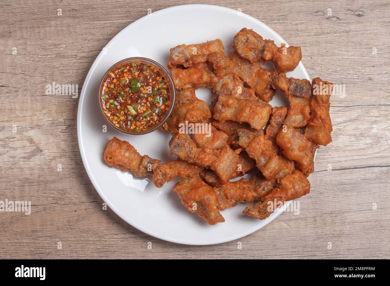 Deep fried pork belly with fish sauce and spicy dipping sauce Stock