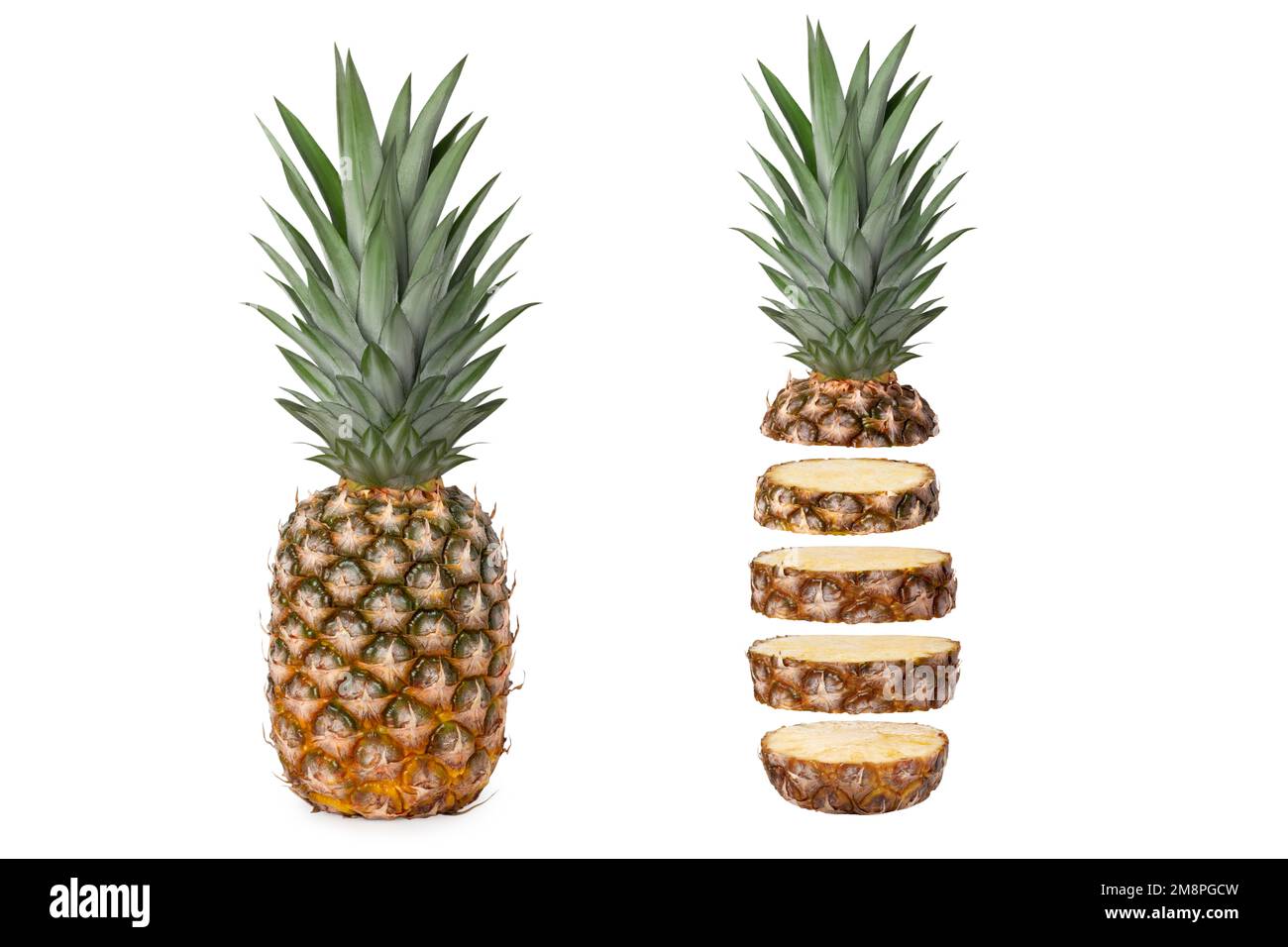 Two fresh juicy pineapples, whole and cut into rings. Isolated Stock Photo Alamy