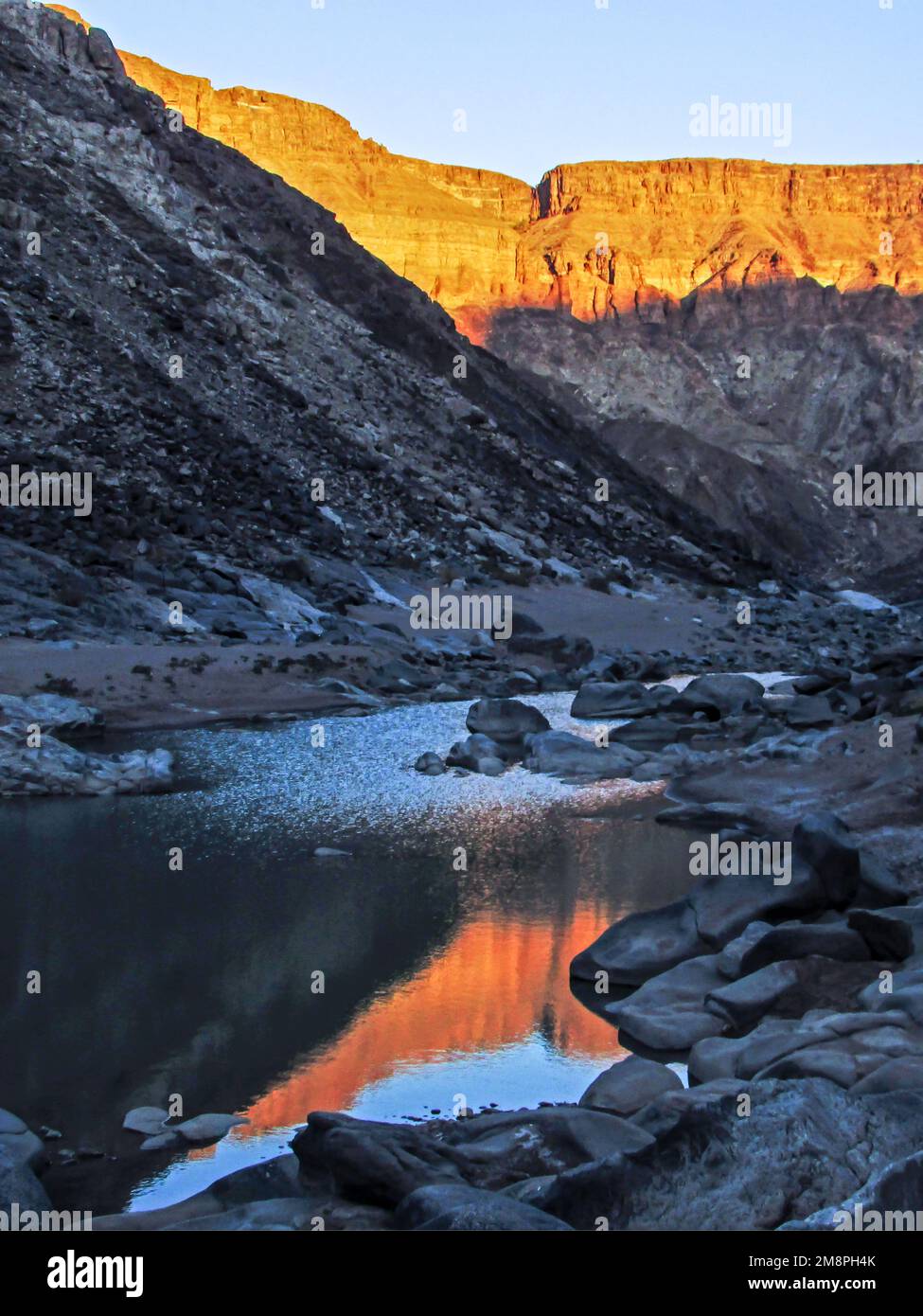 Namibia Cliffs Late afternoon in the Fish River canyon, Namibia, with the last light ...