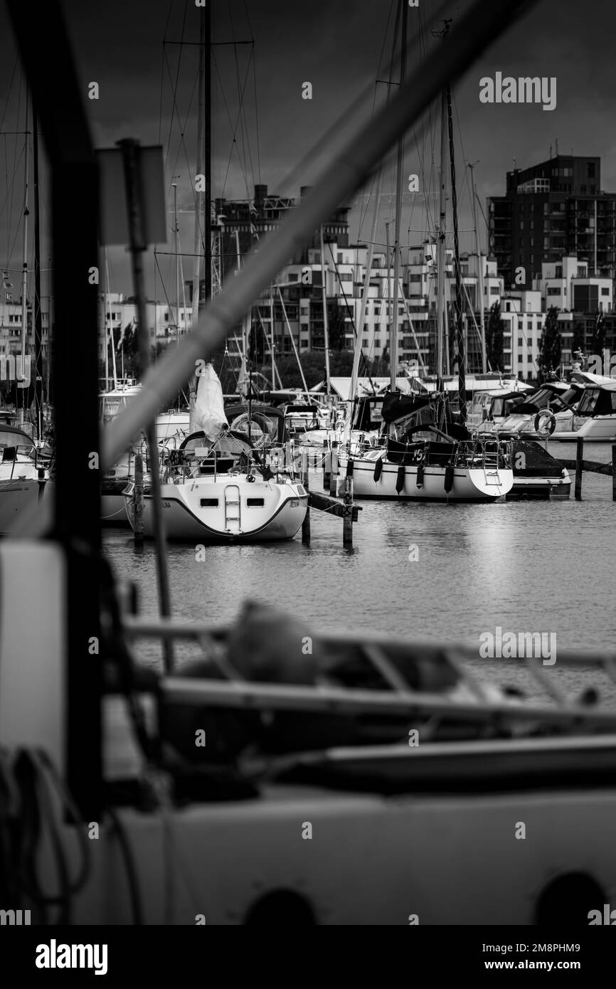A grayscale of line of boats moored at the dock Stock Photo - Alamy