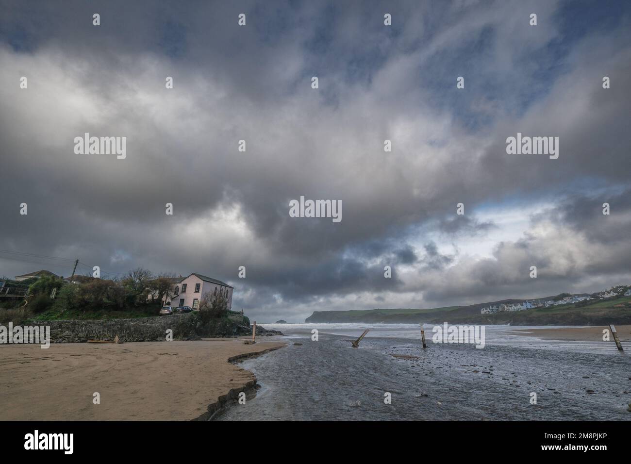 Polzeath, Cornwall, UK. 15th January 2023. Uk Weather. The council run car park next to the beach at Polzeath is starting to be washed away as the small stream that drains into the sea has swollen due to the relentless rainfall. The posts mark the recommended parking area. Credit SImon Maycock / Alamy Live News. Stock Photo