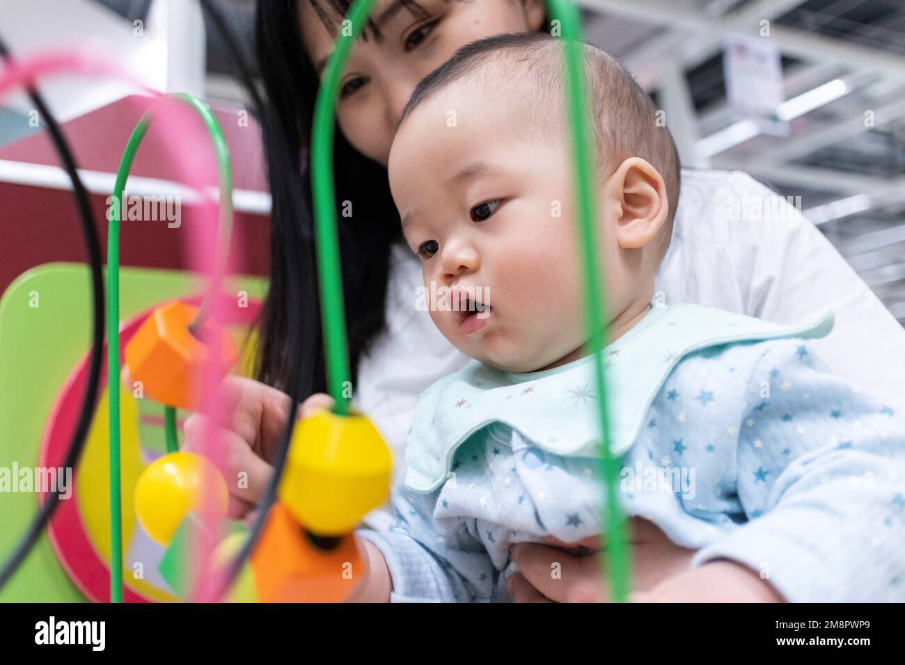 Mother and baby play abacus Stock Photo