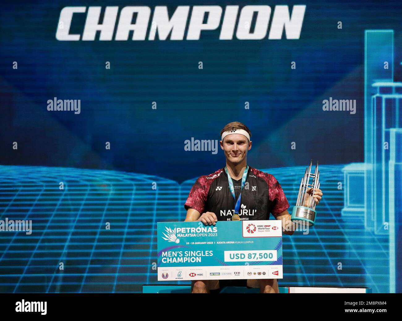 Viktor Axelsen of Denkmark poses with his medal during the medal ceremony after the Mens Single Finals match of the Petronas Malaysia Open 2023 at Axiata Arena.Viktor Axelsen of Denkmark won with