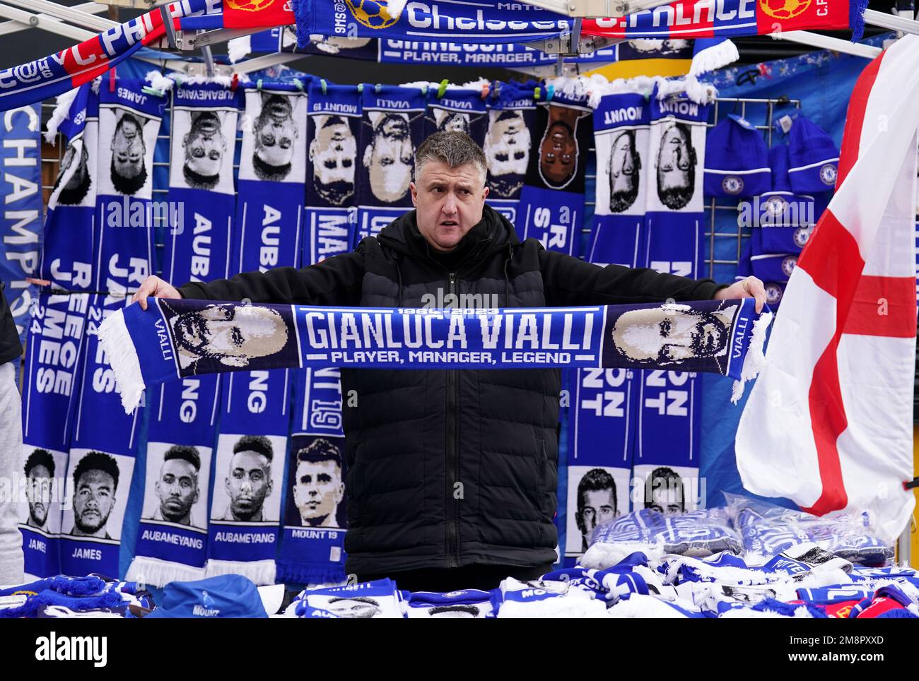 A vendor sells a Gianluca Vialli scarf in memory of the late player ahead of the Premier League match at Stamford Bridge, London. Picture date: Sunday January 15, 2023. Stock Photo