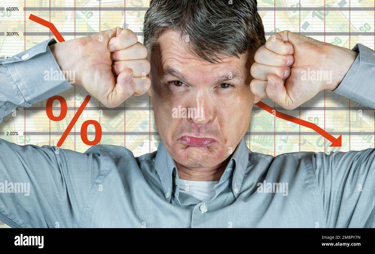 Angry white man, fists clenched in front of negative statistics sheet (with Euro banknotes) Stock Photo